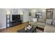 Open living area with a view of the kitchen, offering a modern and connected space at 5400 Roswell Rd # H5, Atlanta, GA 30342