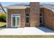 Brick exterior featuring a patio at 8531 Spivey Village Trl, Jonesboro, GA 30236