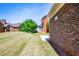View of backyard with brick exterior of home at 8531 Spivey Village Trl, Jonesboro, GA 30236