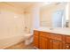 Bathroom featuring a shower/tub combo and a wood vanity at 8531 Spivey Village Trl, Jonesboro, GA 30236