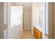 Bathroom featuring a walk-in tub, tiled floors, a shower, and a vanity at 8531 Spivey Village Trl, Jonesboro, GA 30236