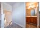 Bathroom on upper level featuring a wood vanity at 8531 Spivey Village Trl, Jonesboro, GA 30236