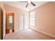 Carpeted bedroom with closet, a window for natural light, and access to another room at 8531 Spivey Village Trl, Jonesboro, GA 30236
