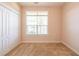 Bedroom featuring a double closet and a large window at 8531 Spivey Village Trl, Jonesboro, GA 30236