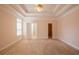 Bedroom with carpet floors, a ceiling fan and a connected bathroom and closet at 8531 Spivey Village Trl, Jonesboro, GA 30236