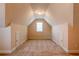 Bonus room with angled ceilings and carpet floors at 8531 Spivey Village Trl, Jonesboro, GA 30236