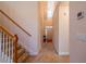 Hallway featuring staircase and view of the home's entrance at 8531 Spivey Village Trl, Jonesboro, GA 30236