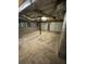 Unfinished basement with two-car garage doors, exposed ductwork, and concrete floor at 2180 Ridge Rd, Canton, GA 30114