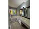 Bathroom featuring a tub, vanity with sink, and natural light from the window at 2180 Ridge Rd, Canton, GA 30114