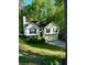 Two-story home with well-maintained lawn and trees at 2180 Ridge Rd, Canton, GA 30114