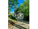 Two-story home featuring mature trees and a well-maintained yard at 2180 Ridge Rd, Canton, GA 30114