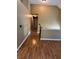 Open hallway with wood flooring connecting living spaces in the home at 2180 Ridge Rd, Canton, GA 30114