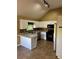 Kitchen with white cabinets, granite countertops and modern appliances at 2180 Ridge Rd, Canton, GA 30114