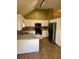 Kitchen featuring white cabinets, modern appliances, and breakfast bar at 2180 Ridge Rd, Canton, GA 30114