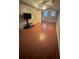 Finished basement living room featuring laminate wood flooring and a ceiling fan at 2180 Ridge Rd, Canton, GA 30114