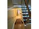 Staircase leading down to laundry area with stylish carpeted treads at 2180 Ridge Rd, Canton, GA 30114