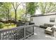 Tranquil back deck with steps leading to a beautifully landscaped backyard at 308 Greenwood Ave, Decatur, GA 30030