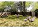 Private backyard features lush grass, firepit, picnic table, and patio furniture, perfect for entertaining outdoors at 308 Greenwood Ave, Decatur, GA 30030