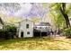 Back of house features deck and shady backyard, perfect for outdoor relaxation and entertaining at 308 Greenwood Ave, Decatur, GA 30030