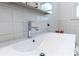 Close-up of bathroom sink with modern faucet and white countertop at 308 Greenwood Ave, Decatur, GA 30030