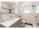 Bright bathroom with white subway tile, modern vanity, and black and white floor at 308 Greenwood Ave, Decatur, GA 30030