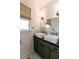 Bathroom featuring double sink vanity, framed mirror, subway tile backsplash, and hexagon tile flooring at 308 Greenwood Ave, Decatur, GA 30030