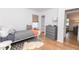 Bright bedroom with wood floors, a single bed with a grey duvet, and a chest of drawers at 308 Greenwood Ave, Decatur, GA 30030
