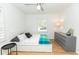 Bright bedroom with a ceiling fan, hardwood floors, and modern decor at 308 Greenwood Ave, Decatur, GA 30030