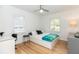 Bright bedroom featuring hardwood floors, a ceiling fan, and modern decor at 308 Greenwood Ave, Decatur, GA 30030