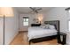 Relaxing bedroom with hardwood floors, a ceiling fan, and a comfortable queen size bed at 308 Greenwood Ave, Decatur, GA 30030