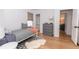 Sunlit bedroom featuring hardwood floors, a single bed, and white walls at 308 Greenwood Ave, Decatur, GA 30030