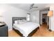 Bright bedroom with hardwood floors, a ceiling fan, and a cozy queen size bed at 308 Greenwood Ave, Decatur, GA 30030