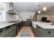 Spacious kitchen with stainless appliances, custom cabinets, granite counters and hardwood floors at 308 Greenwood Ave, Decatur, GA 30030