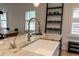 Kitchen island with granite countertop, undermount sink, and modern faucet fixtures at 308 Greenwood Ave, Decatur, GA 30030