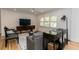 Cozy living room with hardwood floors, large windows, and comfortable seating at 308 Greenwood Ave, Decatur, GA 30030
