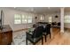 Living room featuring hardwood floors, large windows with shutters, and stylish furniture at 308 Greenwood Ave, Decatur, GA 30030
