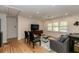 Cozy living room with hardwood floors, bright light and a modern entertainment center at 308 Greenwood Ave, Decatur, GA 30030