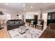 Stylish living room featuring hardwood floors, neutral decor, and ample natural light at 308 Greenwood Ave, Decatur, GA 30030