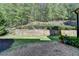 Well-maintained backyard with retaining wall, lawn, and space for outdoor enjoyment at 3330 Camellia Ln, Suwanee, GA 30024