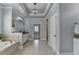 Luxurious bathroom featuring a soaking tub, granite countertops, and a separate shower room at 3330 Camellia Ln, Suwanee, GA 30024