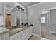Charming bathroom featuring granite counters, tile floors, a shower room and plentiful storage at 3330 Camellia Ln, Suwanee, GA 30024