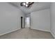 Neutral bedroom featuring a ceiling fan, plush carpet and an attached bathroom area at 3330 Camellia Ln, Suwanee, GA 30024