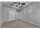 Bedroom featuring a trey ceiling, plush carpet and an attached bathroom area at 3330 Camellia Ln, Suwanee, GA 30024