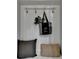 Welcoming entryway featuring decorative hooks and neutral decor, creating an organized and stylish space at 3330 Camellia Ln, Suwanee, GA 30024