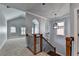 Upstairs landing featuring decorative railing and archways, offering a view into a spacious room at 3330 Camellia Ln, Suwanee, GA 30024