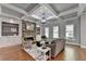 Bright living room features a stone fireplace, built-in shelving, and detailed trim at 3330 Camellia Ln, Suwanee, GA 30024