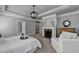 This is a large main bedroom suite featuring a fireplace, seating, and ensuite bathroom at 3330 Camellia Ln, Suwanee, GA 30024