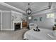 The main bedroom offers an ornate fireplace, a sitting area, and lots of natural light at 3330 Camellia Ln, Suwanee, GA 30024
