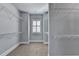 Spacious walk-in closet with carpet floors, shelving and a window at 3330 Camellia Ln, Suwanee, GA 30024