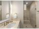 Well-lit bathroom with a single sink vanity, tile floors, and a spacious glass-enclosed shower at 3630 Peachtree Ne Rd # 3207, Atlanta, GA 30326